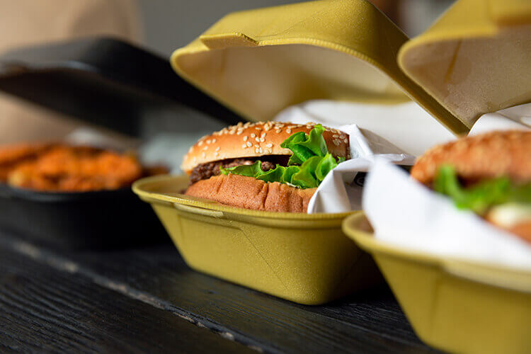Hamburger in a take-away container