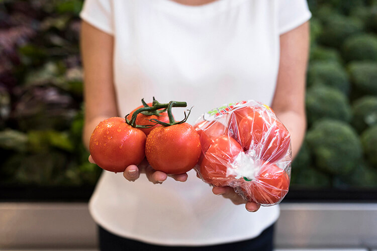 loose tomatoes in hand