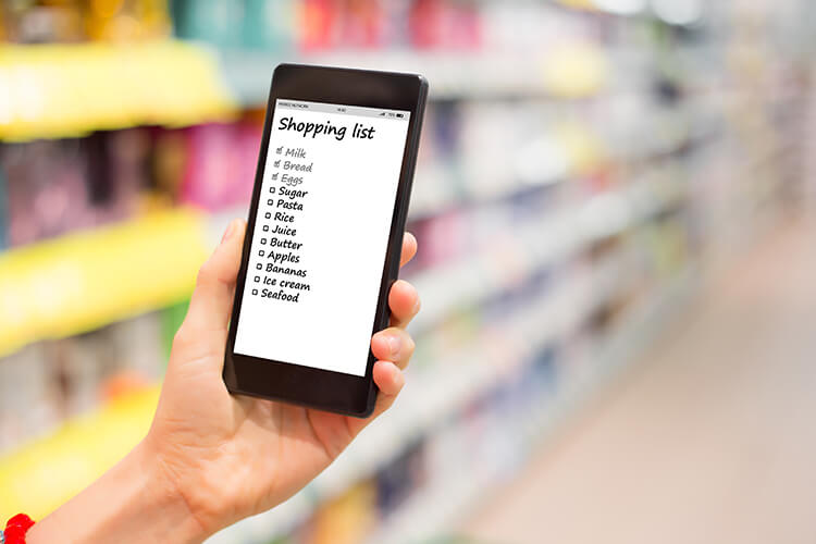 smart phone with a digital shopping list on screen