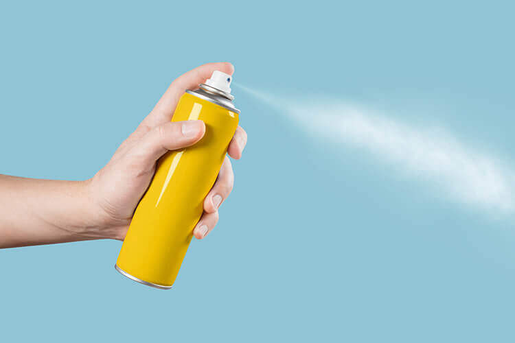 aerosol can being sprayed