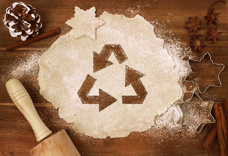 biscuit dough with the recycling symbol cut out of it