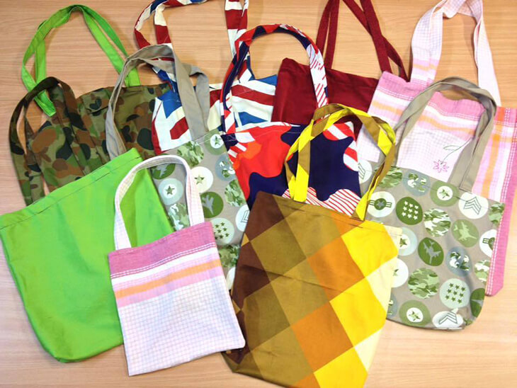 display of tote bags made from old clothes