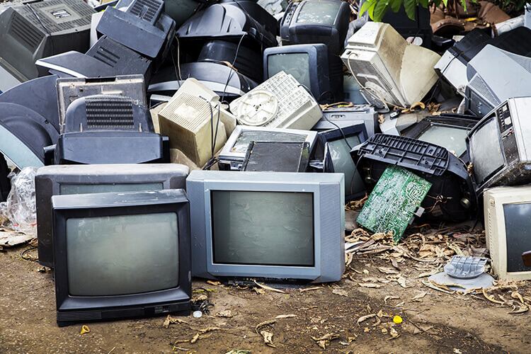 pile of old televisions