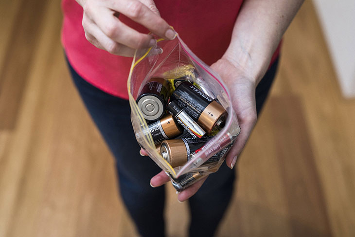 Bag of used household batteries