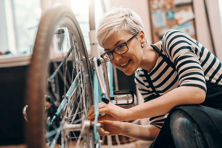 Woman checking her bike