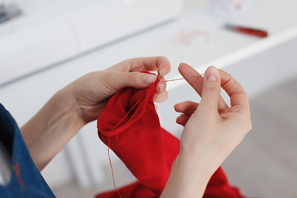 close up of woman knitting