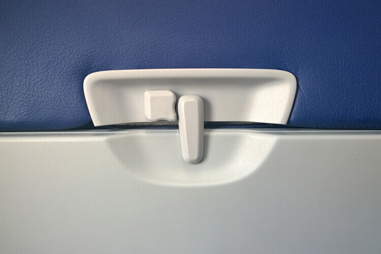 close up of the back of a seat on a plane