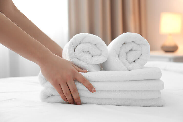 folded towels on a bed