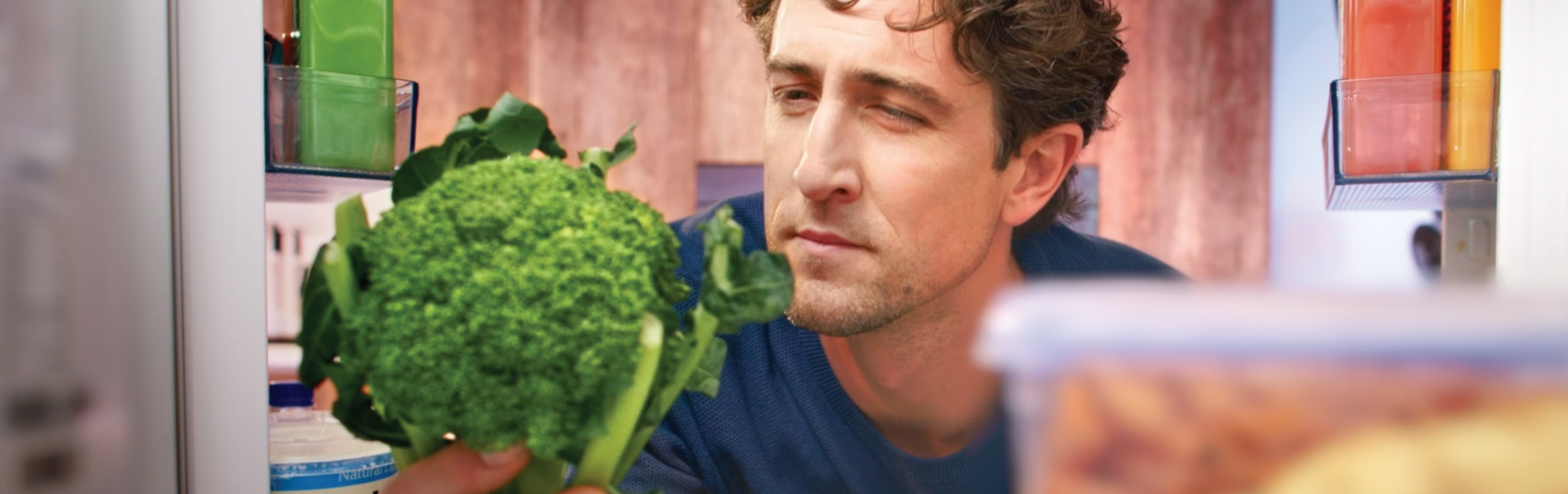 man holding a broccoli