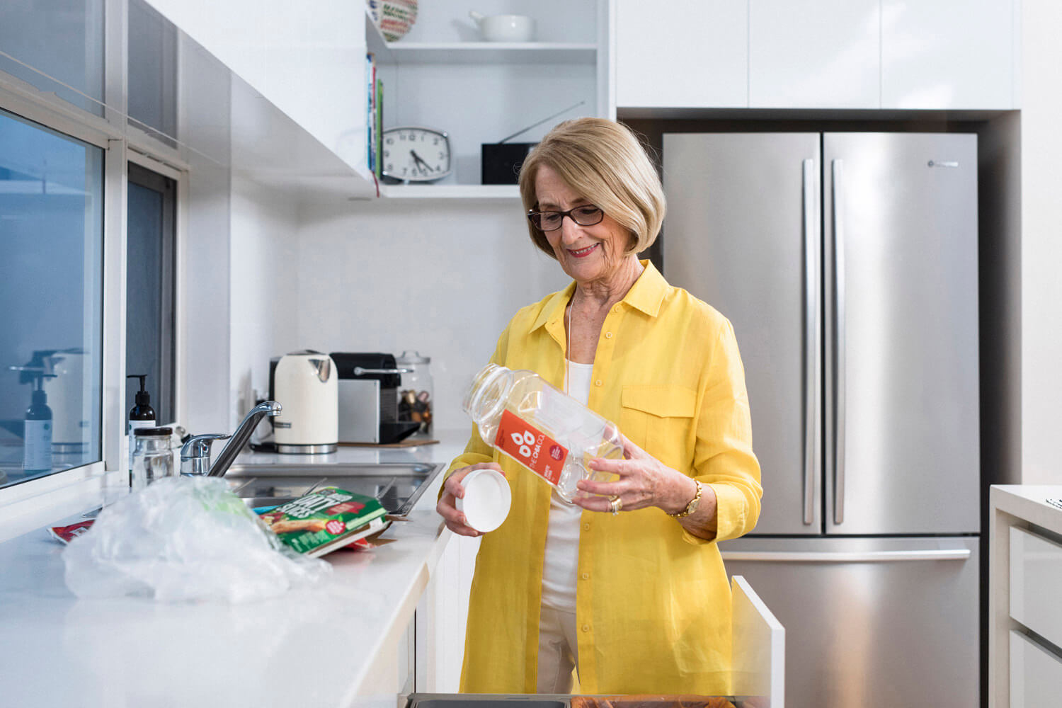 lady separating a plastic container from its lid